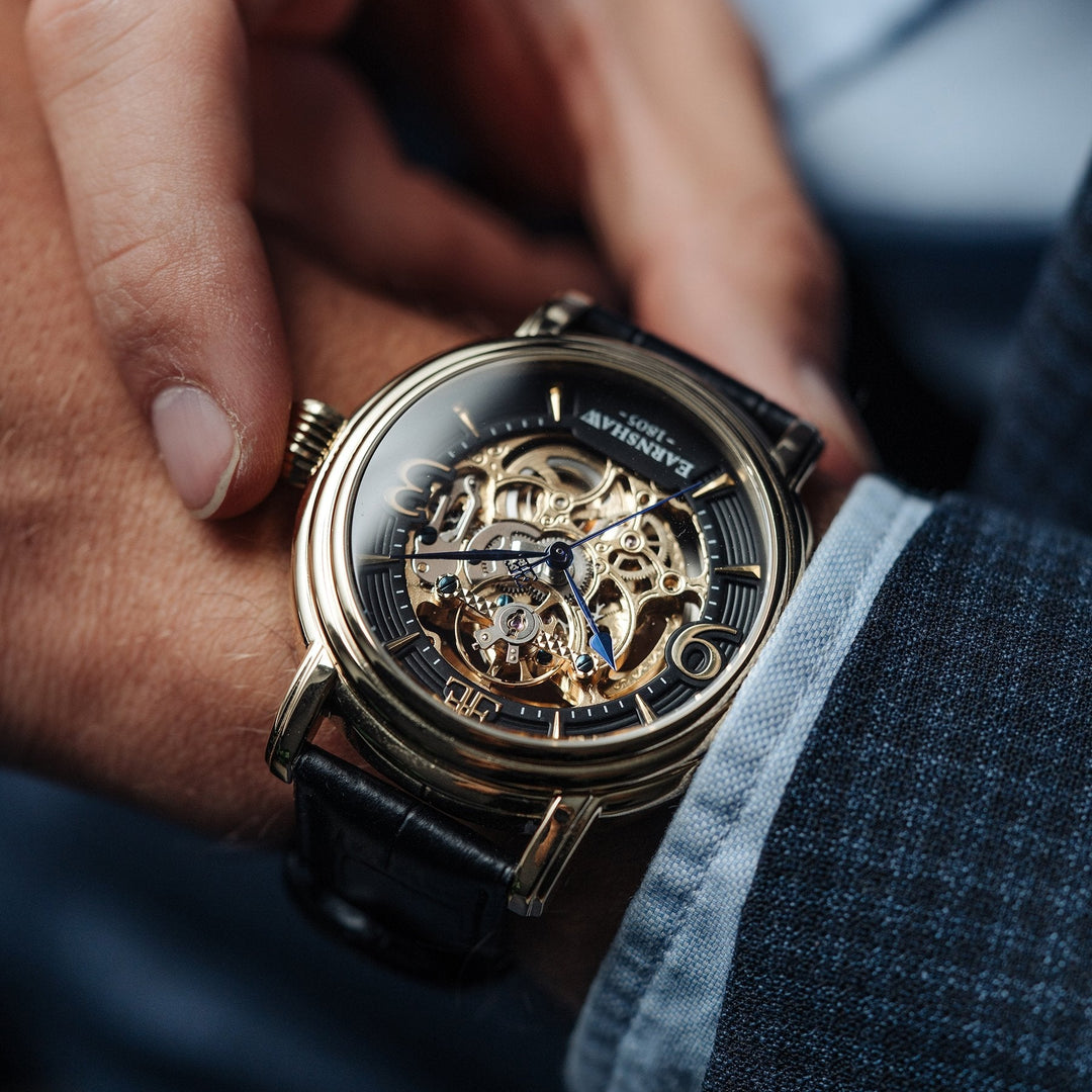 THOMAS EARNSHAW LONGCASE GRANDE SKELETON AUTOMATIC Laurel Gold