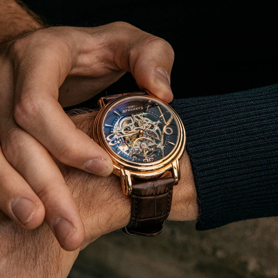 THOMAS EARNSHAW LONGCASE GRANDE SKELETON AUTOMATIC Brandy Rose Gold