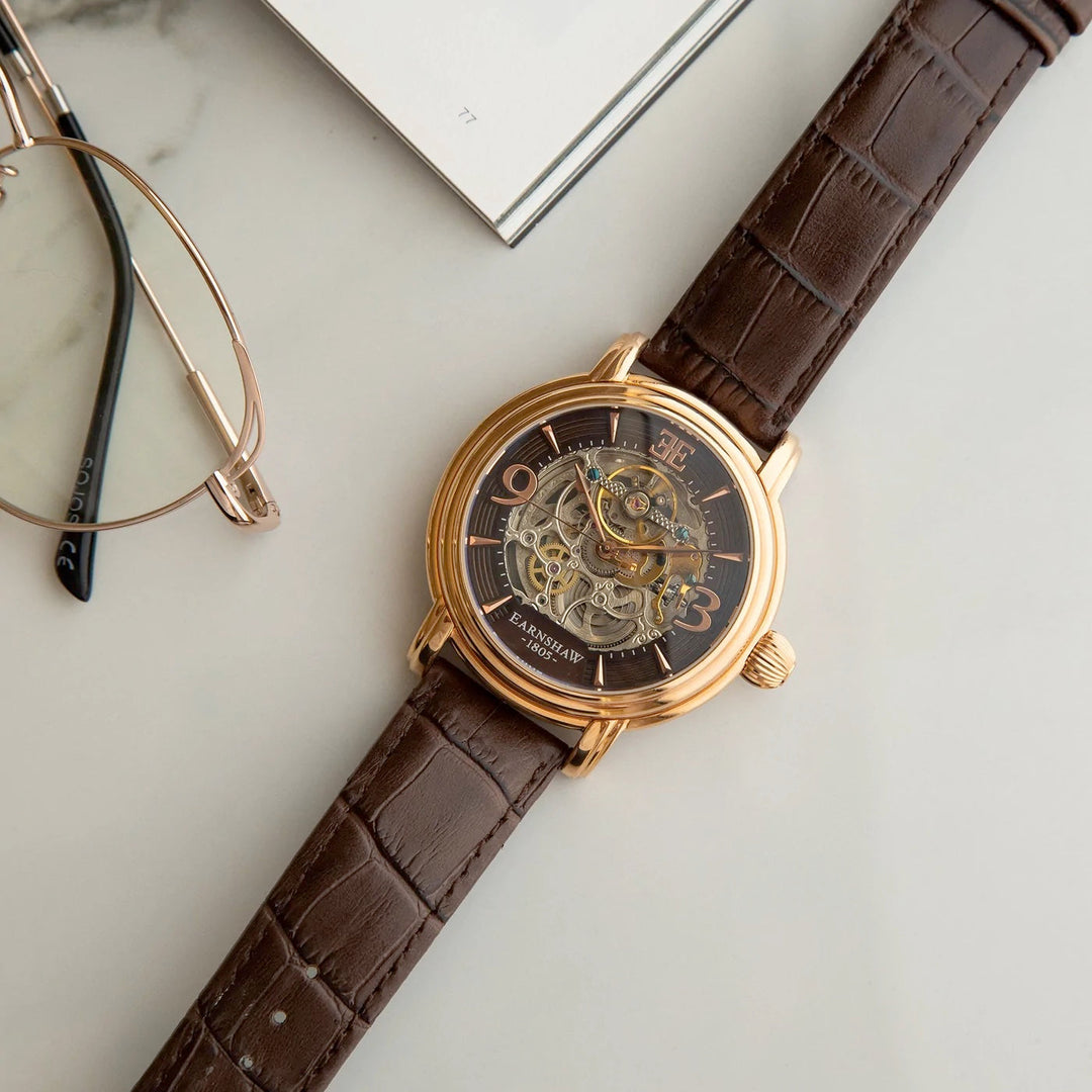 THOMAS EARNSHAW LONGCASE GRANDE SKELETON AUTOMATIC Brandy Rose Gold